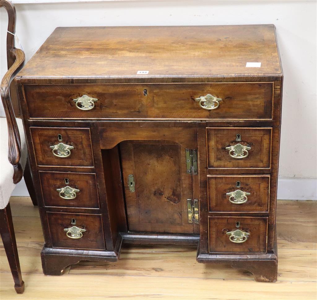 A mid 18th century walnut kneehole desk, width 76cm, depth 43cm, height 73cm